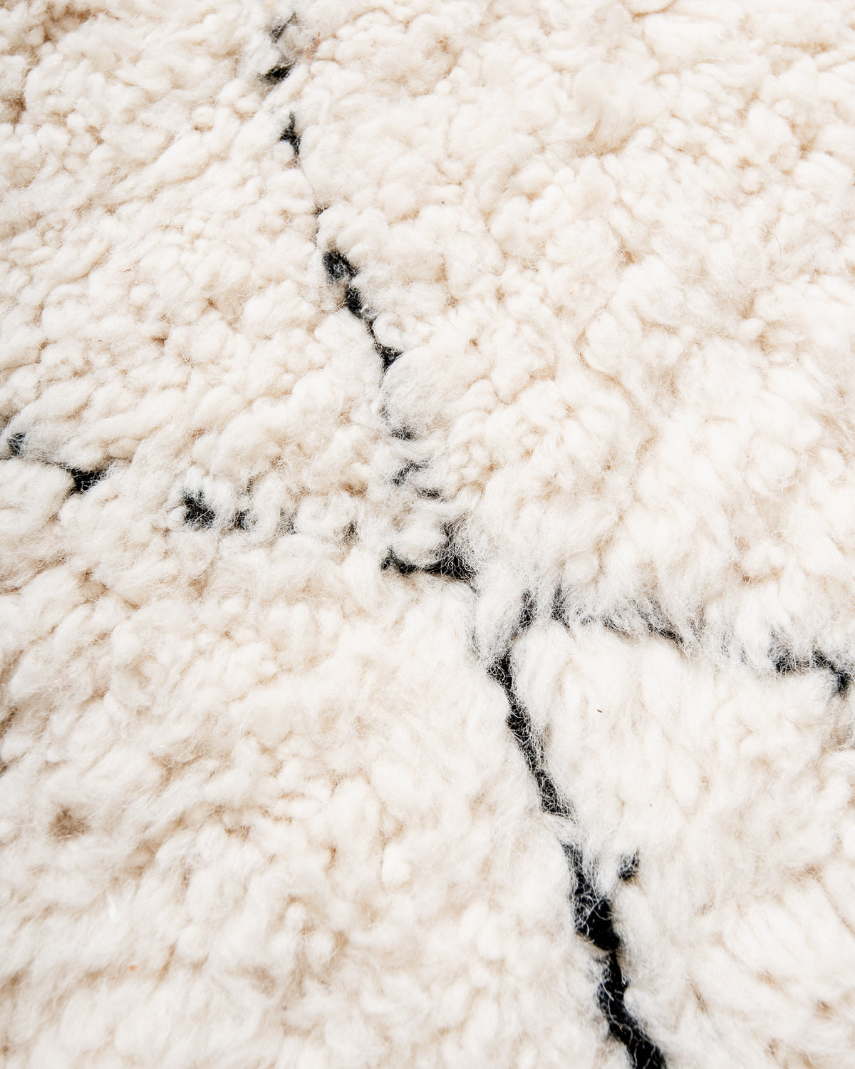 Modern, designer, handcrafted Berber rug from Morocco. Beniourain carpet with minimalist design, natural wool pile and a fluffy texture.